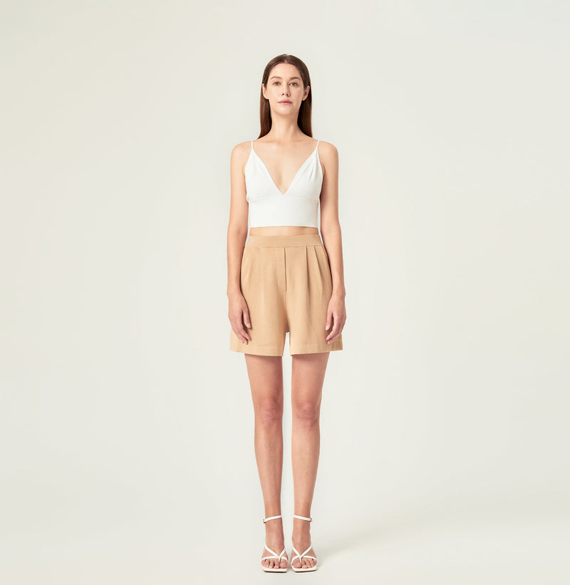 Pleated shorts women in sand color. front-view