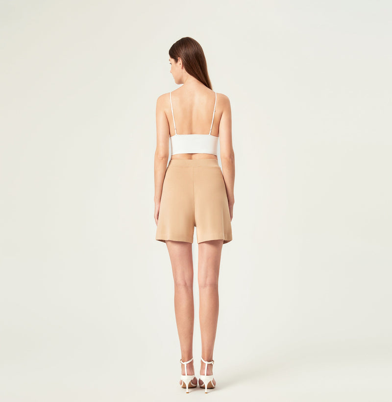 Pleated shorts women in sand color. rear-view