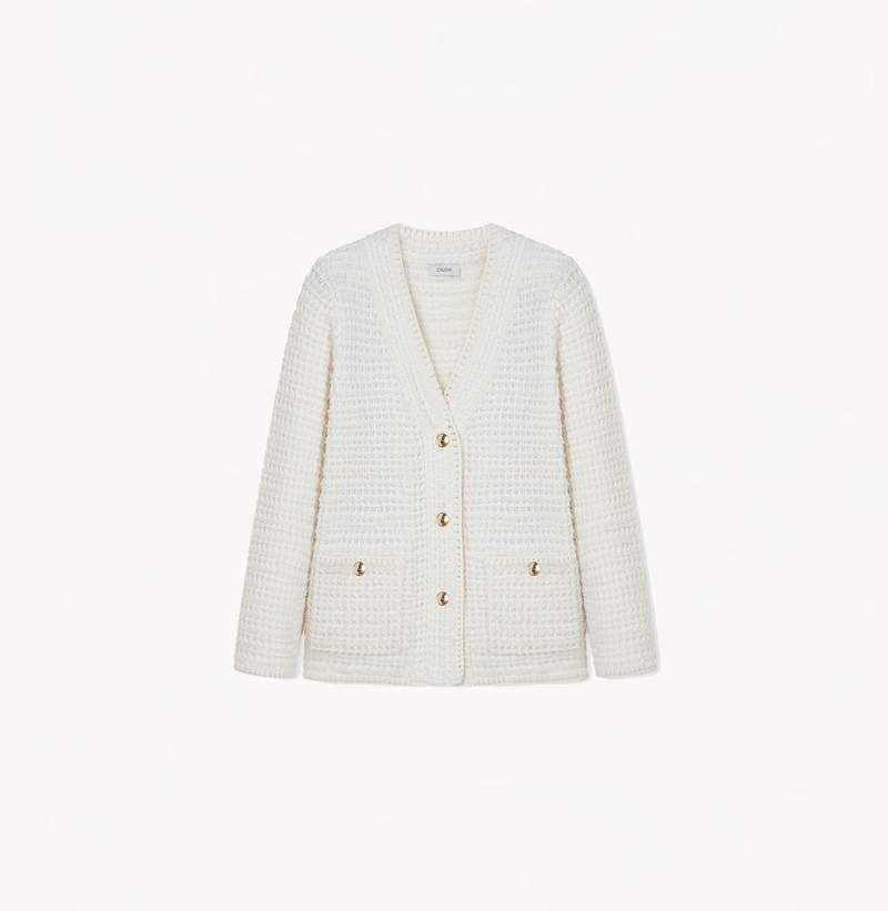 Boucle jacket with a v-neck in white.