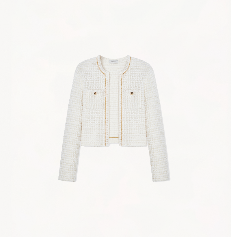 Women's cropped boucle jacket in white.