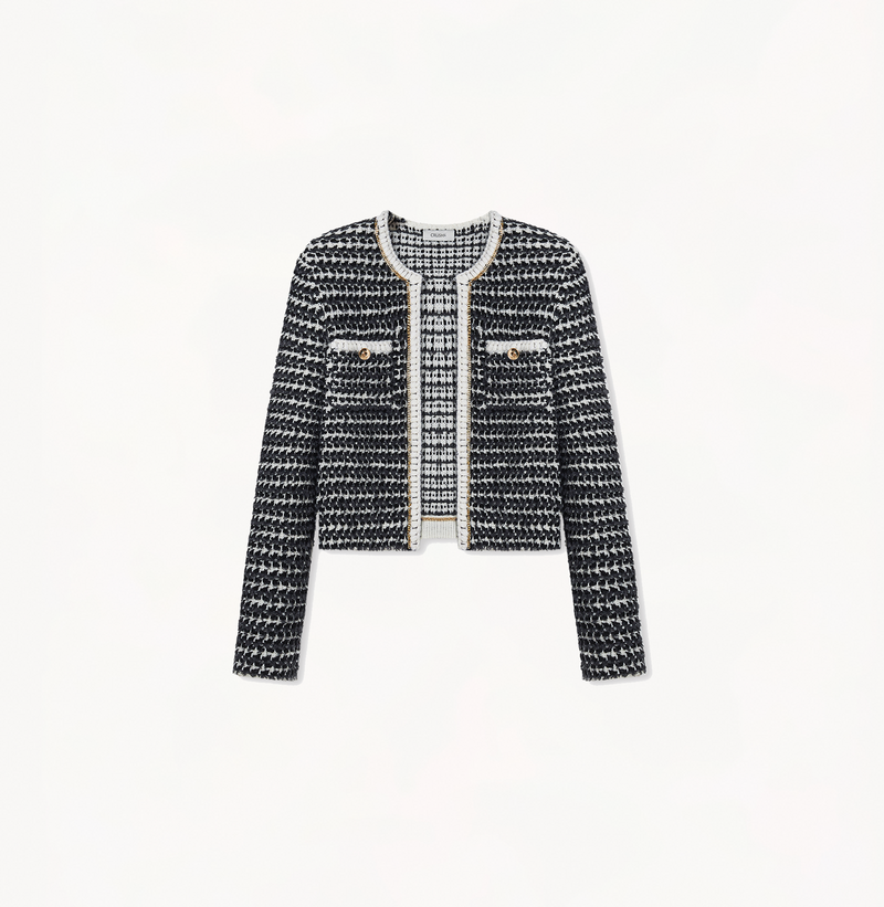 Women's cropped boucle jacket in black and grey stripes.