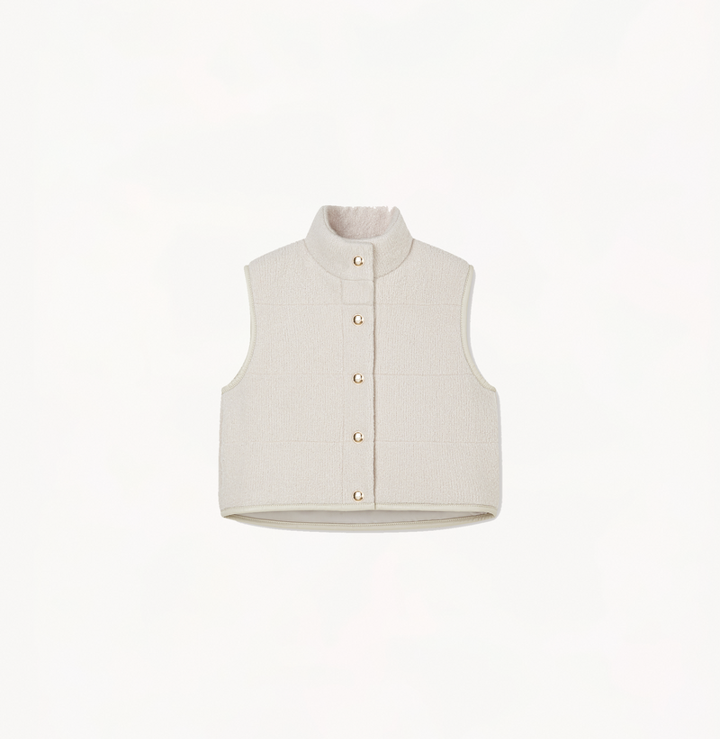 Women's quilted vest with a stand collar in oatmeal.