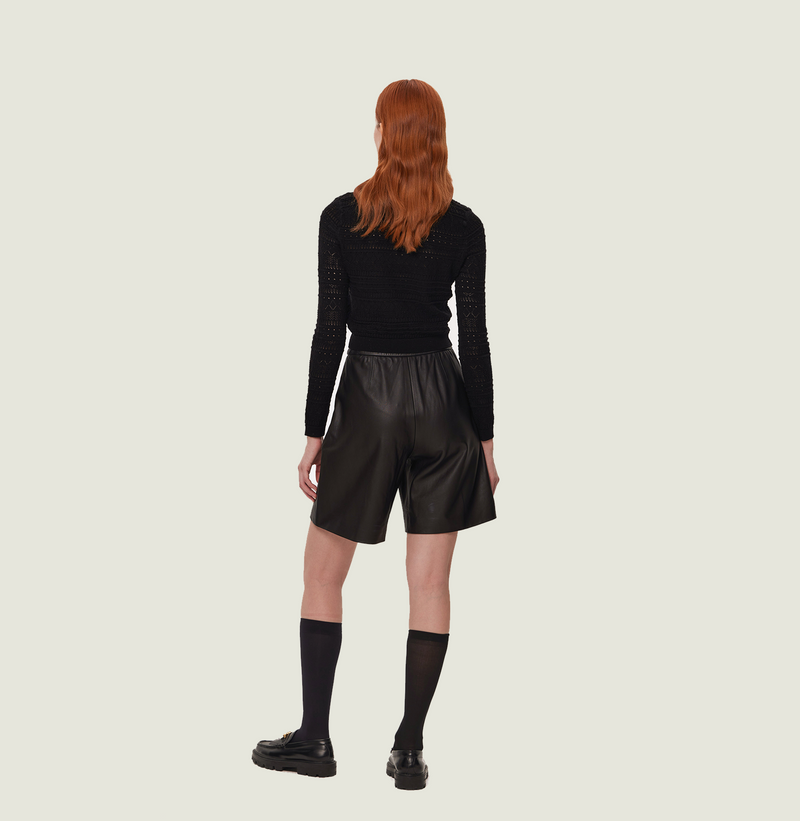 Wool long-sleeve top with lace in black. rear-view