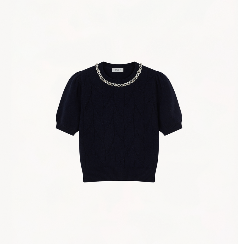 Wool pointelle knit sweater in navy blue with balloon sleeves.