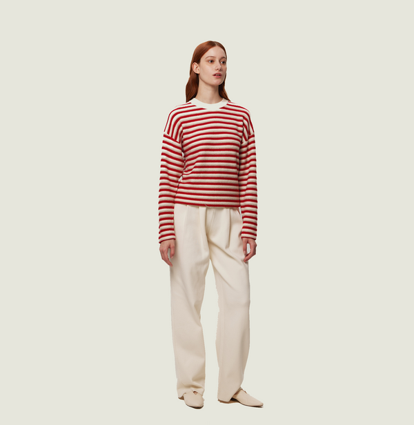 Wool stripped sweater in red and white jacquard stripes. front-view